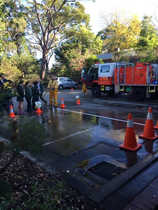 Fun with water: Warrimoo Bush Fire Brigade giving some hands-on experience to students