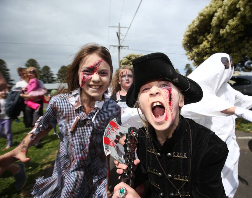 Just for fun: Eva Zerbos and Tullulah Cooling took to the streets of Port Fairy for the annual Zombie Shuffle. Picture: Vicky Hughson 