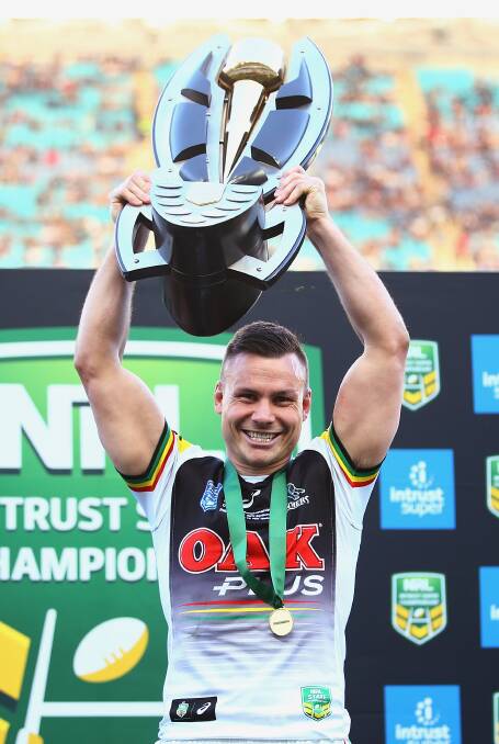 Panthers captain Darren Nicholls lifts the NRL Intrust Super State Championship trophy. Picture: NRL Photos