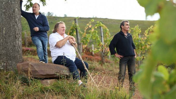 Avert your eyes if you can: Gerard Depardieu (centre) eats his way around Europe with chef Laurent Audiot (left). Photo: SBS TV