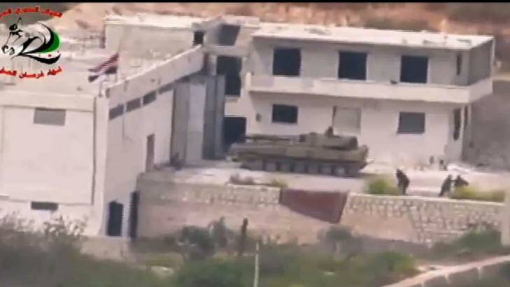 Footage supplied by the Free Syrian Army's Fursan al-Haq Brigade shows a Syrian tank near Ariha, in Syria's Idlib province, moments before a TOW missile strike. Photo: supplied