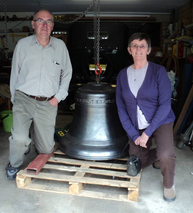 New arrival: St Hilda's Anglican Church members and church bell project co-ordinators Malcolm Ireland and Sue Stones with the largest of the bells.