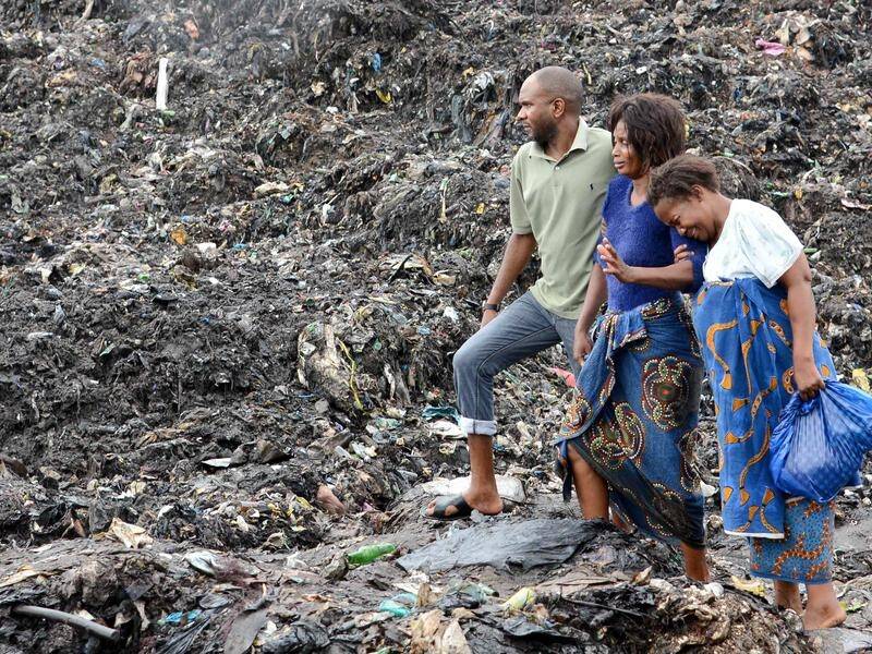 A garbage dump has collapsed in the Mozambique capital, burying seven houses and killing 17 people.