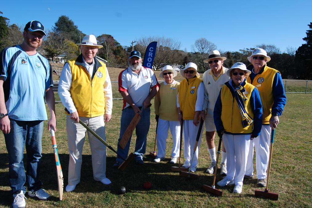 Oliver Gaul, chairman of Blue Mountains Cricket Association, Barry Moray, president of the Blue Mountains Croquet Club, and Ian Strudwick from the cricket association, with croquet club members at Peter Carroll Field.