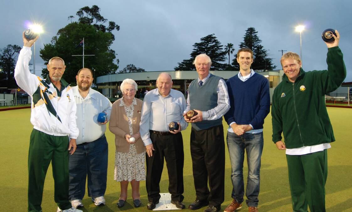 Light fantastic: Lawson Bowling Club's vice president Greg Howlett, honorary secretary and treasurer Andrew Frater, co-vice president Ruby Dening, chairman Neville Lalor, Max and Colin Fragar from Fragar Planning and Development and greenkeeper Rod Crean celebrate the official switching on of the club's floodlights on December 11.