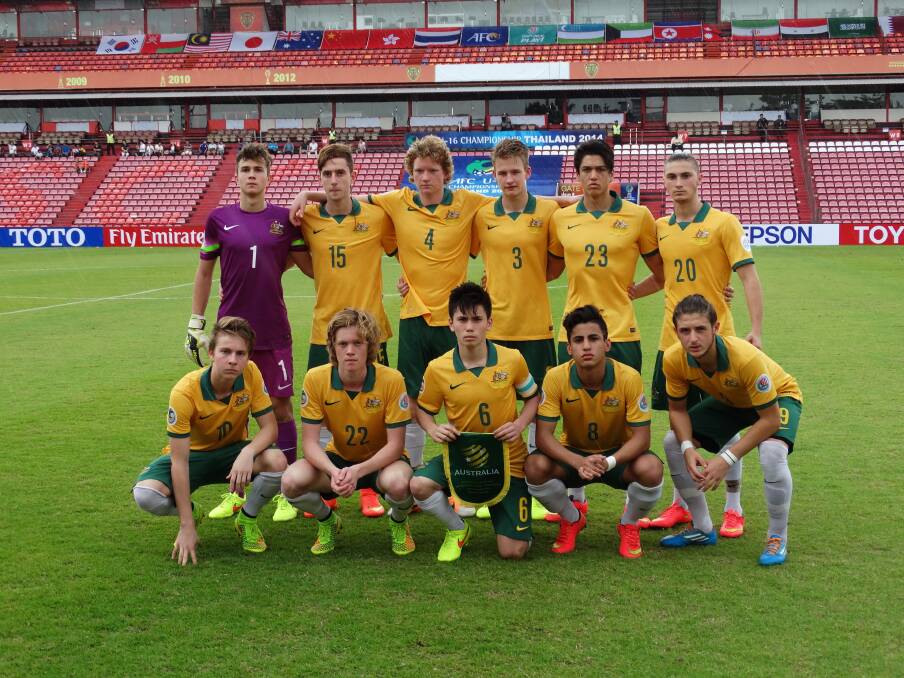 Springwood's Henry Davies (wearing number 3 in the back row) with his Joeys teammates at the AFC U16s Championships held in Thailand last week. The team qualified for the 2015 U17 Football World Championships by finishing in the top four. Photo: Football Federation Australia.