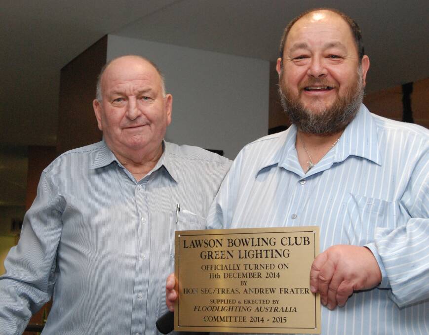 Marking a milestone: Lawson Bowling Club committee chairman Neville Lalor and honorary secretary and treasurer Andrew Frater with a plaque marking the launch night of the club's floodlights.