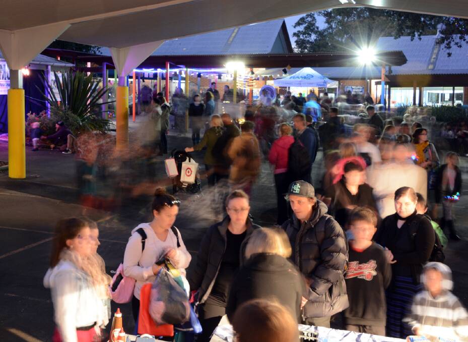 Under lights: A large crowd attended the fete.