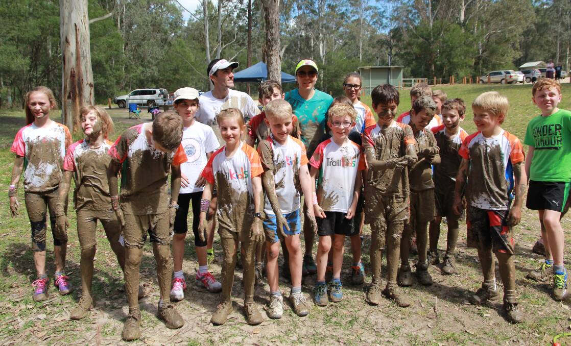Trail Kids founders Brendan Davies and Jo Brischetto with the kids at the end of the camp.