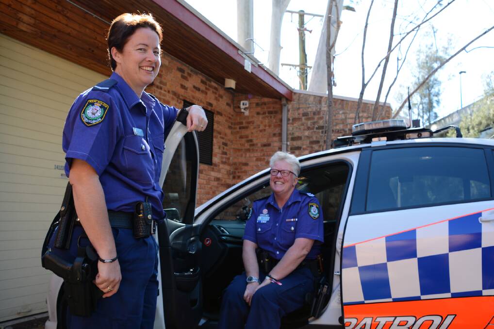Constable Kirstin McGilchrist and senior constable Mary-Lou Keating from Blue Mountains Police sporting purple police uniforms on August 28 in support of Wear It Purple Day.