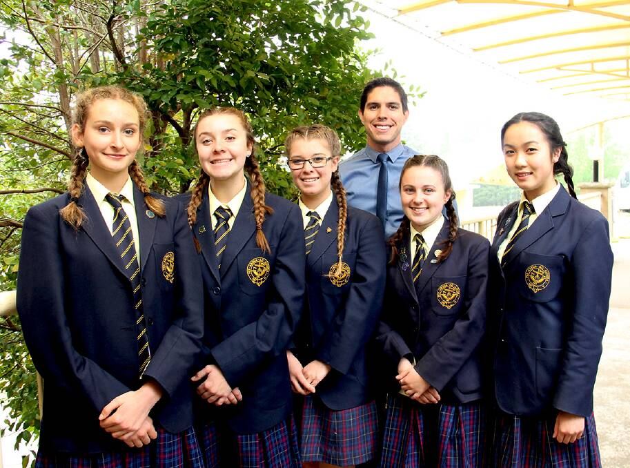 Team effort: Blue Mountains Grammar School students and Collision Racing teammates in the F1 in Schools competition Julia Chabros, Maddison Traynor, Charlotte Toose-Cutler, Emma Hunter and Julie Lao with their teacher Michael Laws.