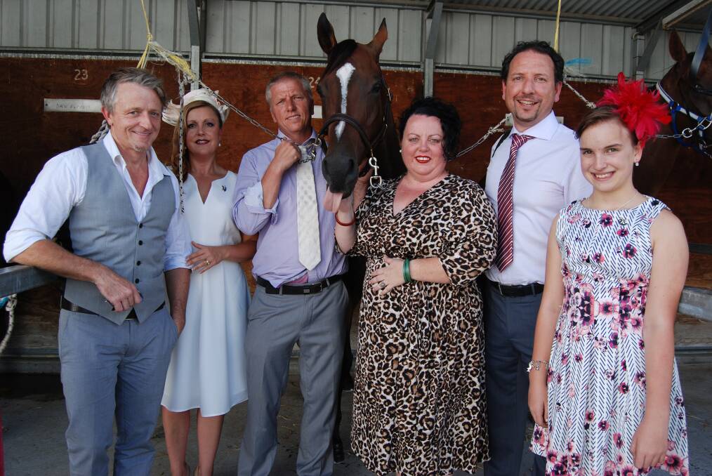 Wentworth Falls racehorse owners Jeremy Shadlow, Charmaine Antarakis, Dean Mirfin (trainer), Sue Gainsford-Holland, Mike Antarakis and daughter Bella with Oywotzy at Bathurst on Sunday.