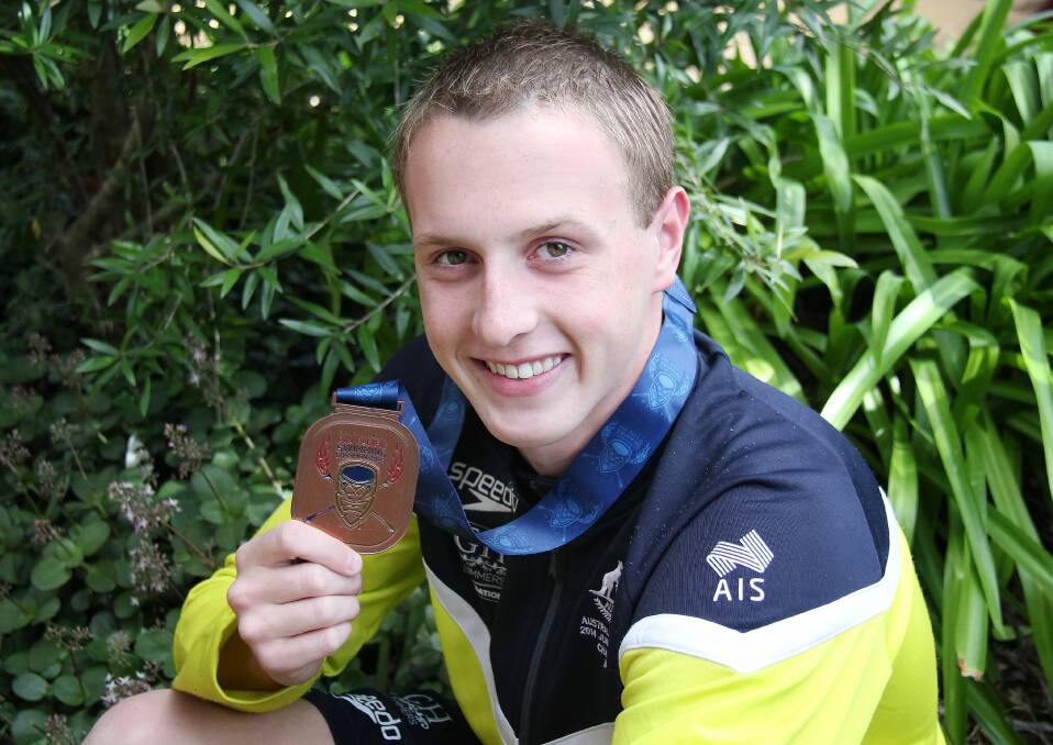 Springwood swimmer Matt Wilson, 15, with the bronze medal he won for Australia in the boys' 200m breaststroke final at the 2014 Junior Pan Pacific Championships held in Maui, Hawaii on August 30.