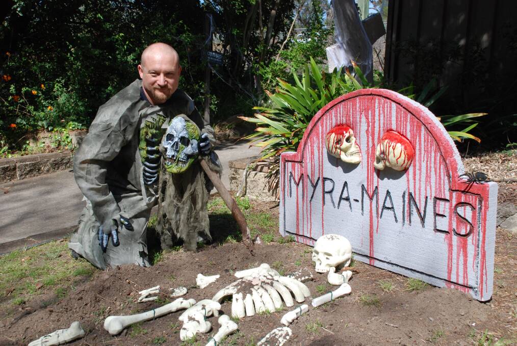 Michael Pinkus in his Blaxland yard, which he has decked out in preparation for Halloween on Friday.
