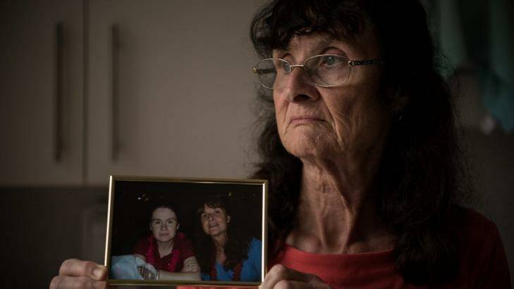 Maureen McIlquham holds a photo of herself and her daughter, Michelle, who died of meningitis in 2009.  Photo: Wolter Peeters