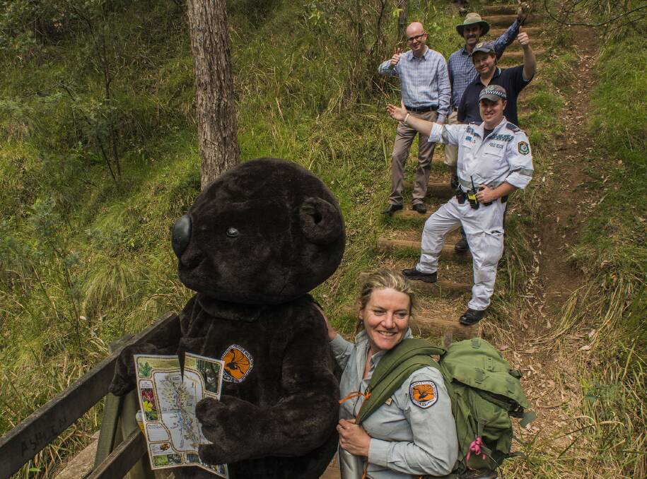 NPWS mascot Wanda the Wombat with NPWS' Jacqueline Reid, NSW Police Rescue Senior Constable Chris Jayne, BMLOT chairman Daniel Myles, NPWS Blue Mountains regional manager Alan Henderson and Blue Mountains mayor Mark Greenhill. Photo: David Hill, Blue Mountains Lithgow and Oberon Tourism