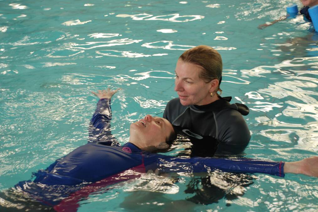 Like a starfish: Learn to swim instructors Amanda Rogers and Nicola Watson practise teaching how to float on your back.