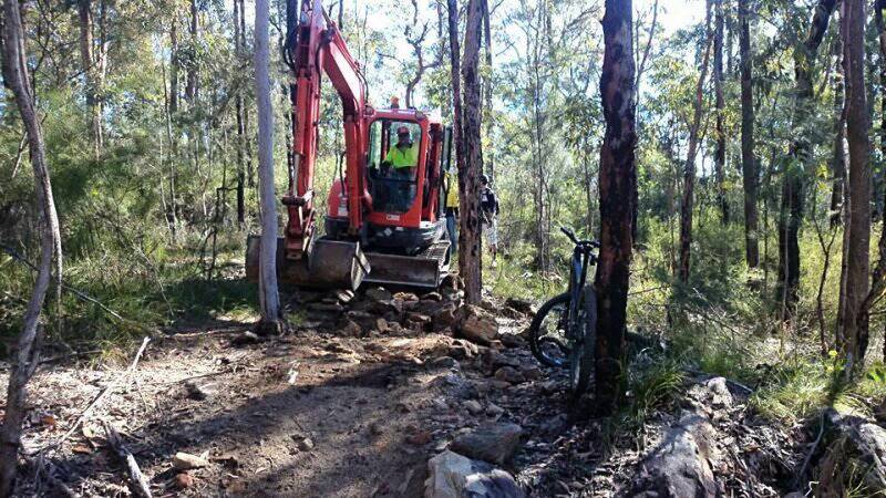 Closing it down: Bulldozing begins on June 22 on a section of track known by mountain bike riders as the Chicken Run in bushland along a valley floor near Mt Riverview. Photo: BMORC.