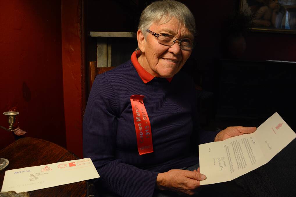 Gilgandra local Janet Cheal inside the Imperial Hotel in Mt Victoria, showing her letter of appreciation from Buckingham Palace for sending an information package to the Queen about the Cooee re-enactment march.