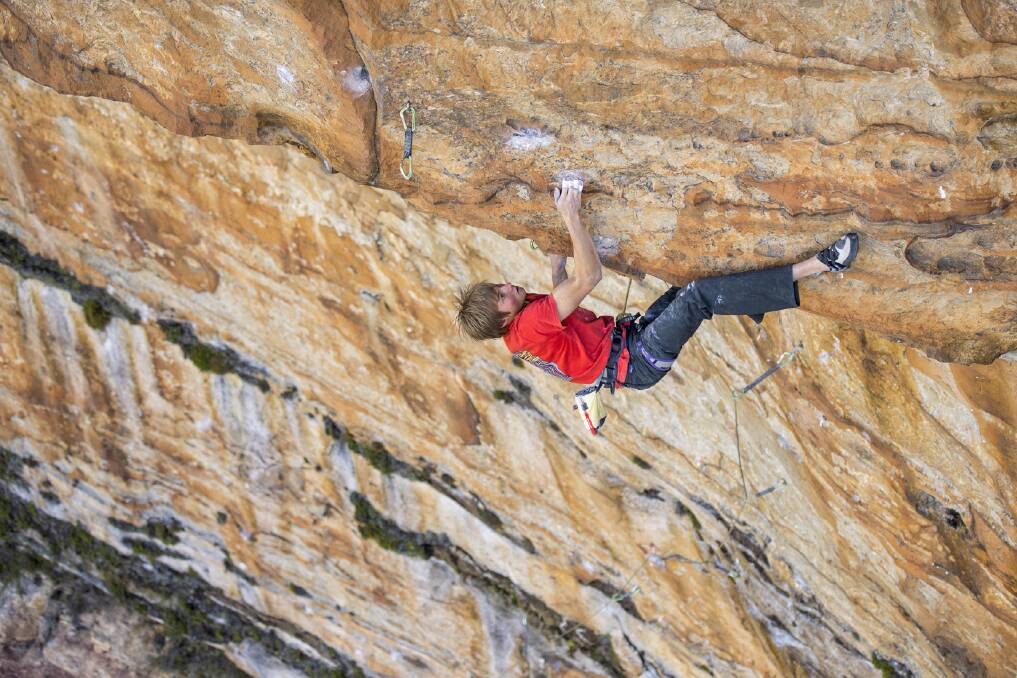 Hang on: Alex Megos making the first ascent of Schweinebaumeln (grade 35), at Elphinstone in the Blue Mountains on April 9. Photos: Simon Carter/Onsight Photography.