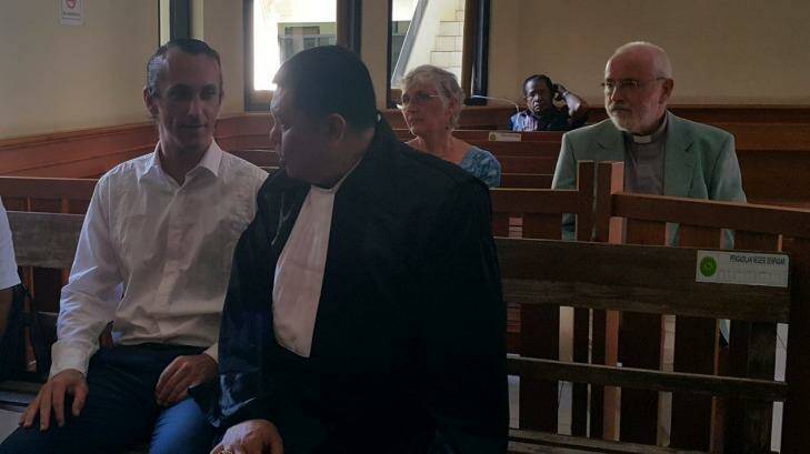 David Taylor waiting for his trial to start at Denpasar District Court on Wednesday, with his lawyer Haposan Sihombing (right) and behind him his parents John and Janet. Photo: Amilia Rosa