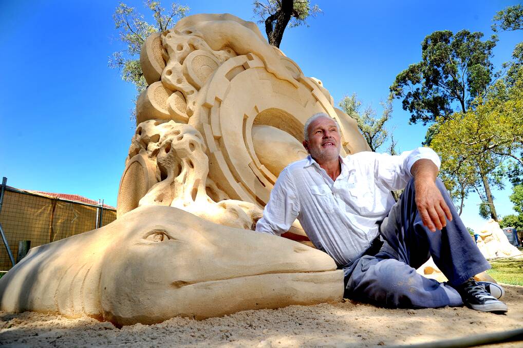 Lawson's Jino Van Bruinessen with his winning sculpture at the Windsor International Sand Sculpting competition in 2014. He is competing at the 2015 Australian Sand Sculpting Championships at the Gold Coast this weekend. Picture: Kylie Pitt.