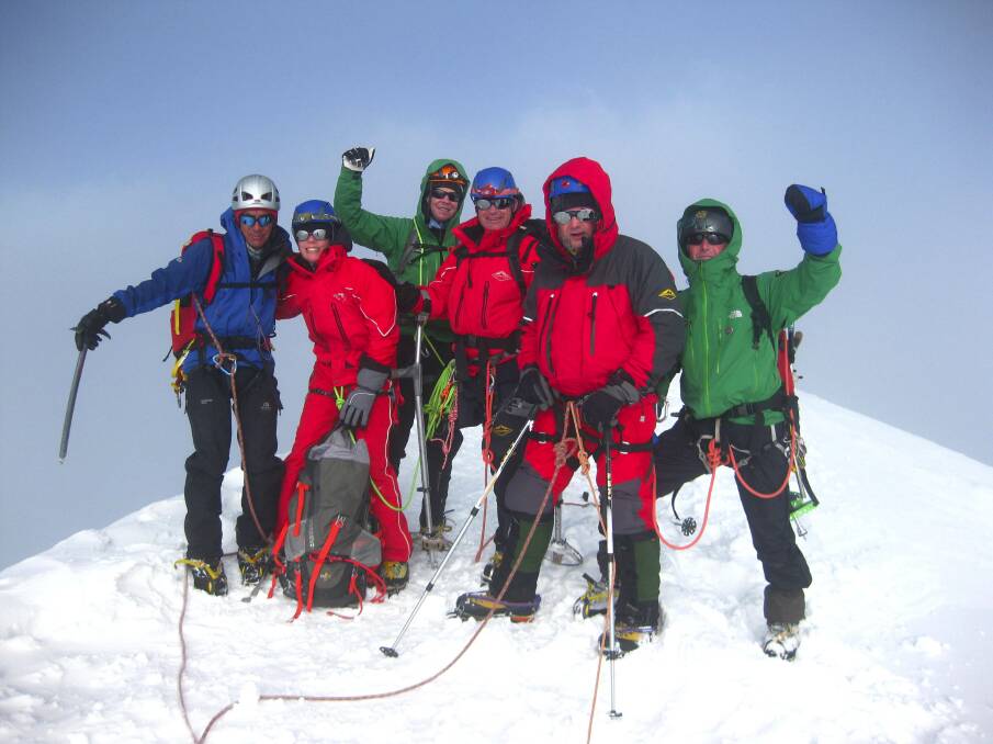 Paul Raciborski of Woodford (second right) on Breithorn's summit with his team and Adventure Consultants guides. The group drew attention to the mental mountains being climbed every day by many people.