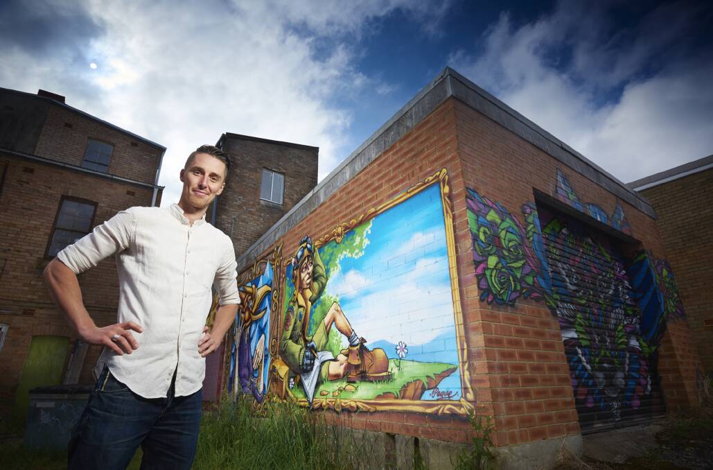 Street Art Mural Australia co-ordinator Jarrod Wheatley, pictured in Katoomba, as he appears on the cover of the latest Penrith Yellow and White Pages.