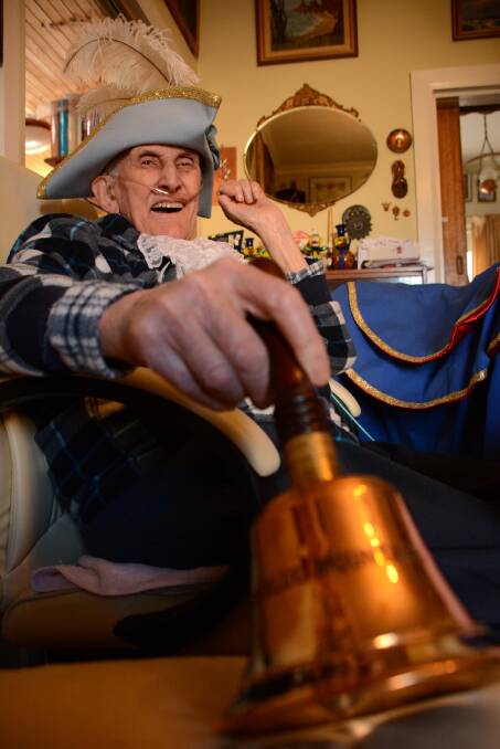 Blue Mountains town crier Dennis Hitchen at his Lawson home in early July, ringing his bell for the last time.