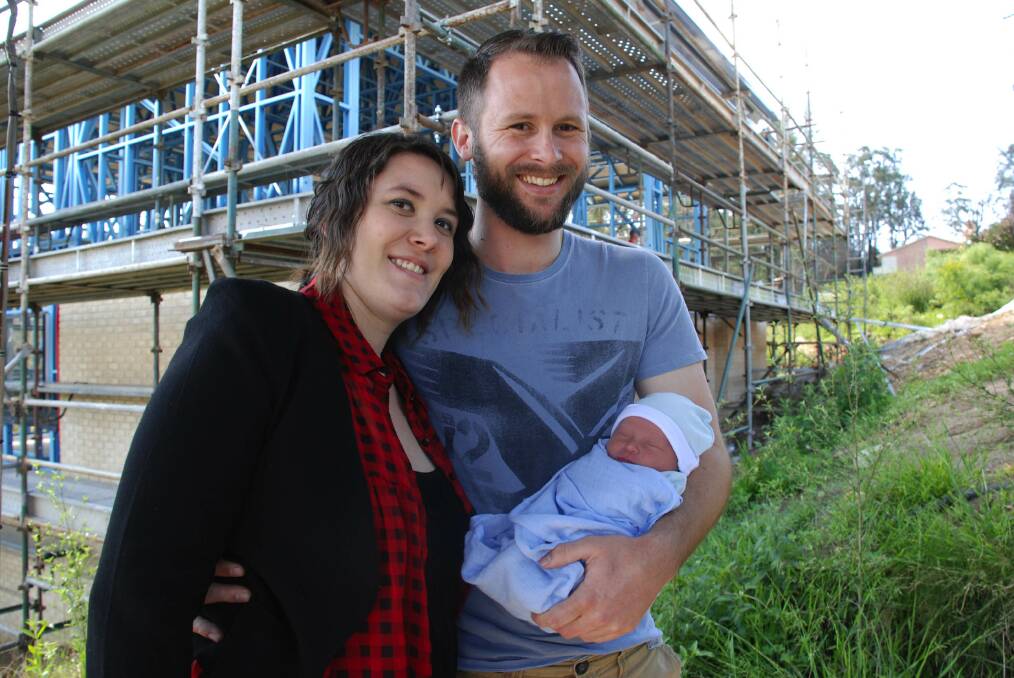 Bushfire baby Isaac James, the first child of police officer Brett Thomson and his teacher wife Leila, arrived on October 10 and will take up residence when their new home rises from the ashes at number 30 early next year. "We were blessed to be able to afford to rebuild," Mr Thomson said.