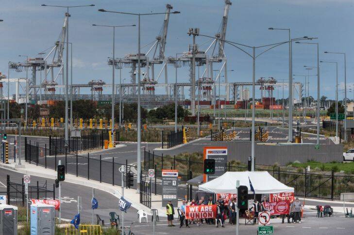 More than 1000 shipping containers carrying retail goods, Christmas decorations, fresh food and medicine remain stranded on Mebourne's waterfront, as a picket line blockading a major container terminal enters its second week.