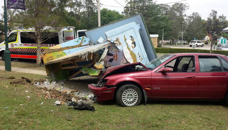 The crash that destroyed the original bus shelter and mural on December 4, 2013. Photo: Top Notch Video.