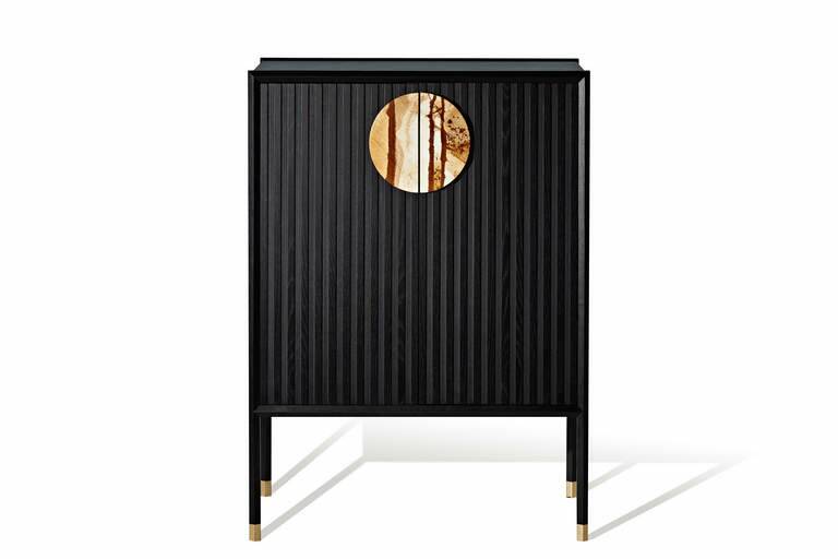 Black & Gold Halo storage cabinet with Palomino marble handle, $6800, zuster.com.au. Photo: Supplied
