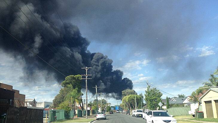 Smoke from the factory fire near Liverpool in Sydney's south-west. Photo: Amanda Hoh