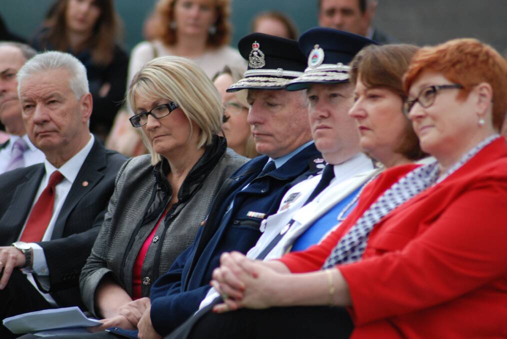 Paying their respects: Senator Doug Cameron, Member for Macquarie Louise Markus, Fire and Rescue NSW Commissioner Greg Mullins, RFS Commissioner Shane Fitzsimmons, Member for Blue Mountains Roza Sage and NSW Minister for Human Services and Western Sydney Marise Payne.