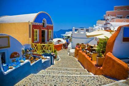 Idyllic: Bright colours under a blue sky over Santorini, one of the Greek islands visited on Tempo's Iconic Aegean cruise.   