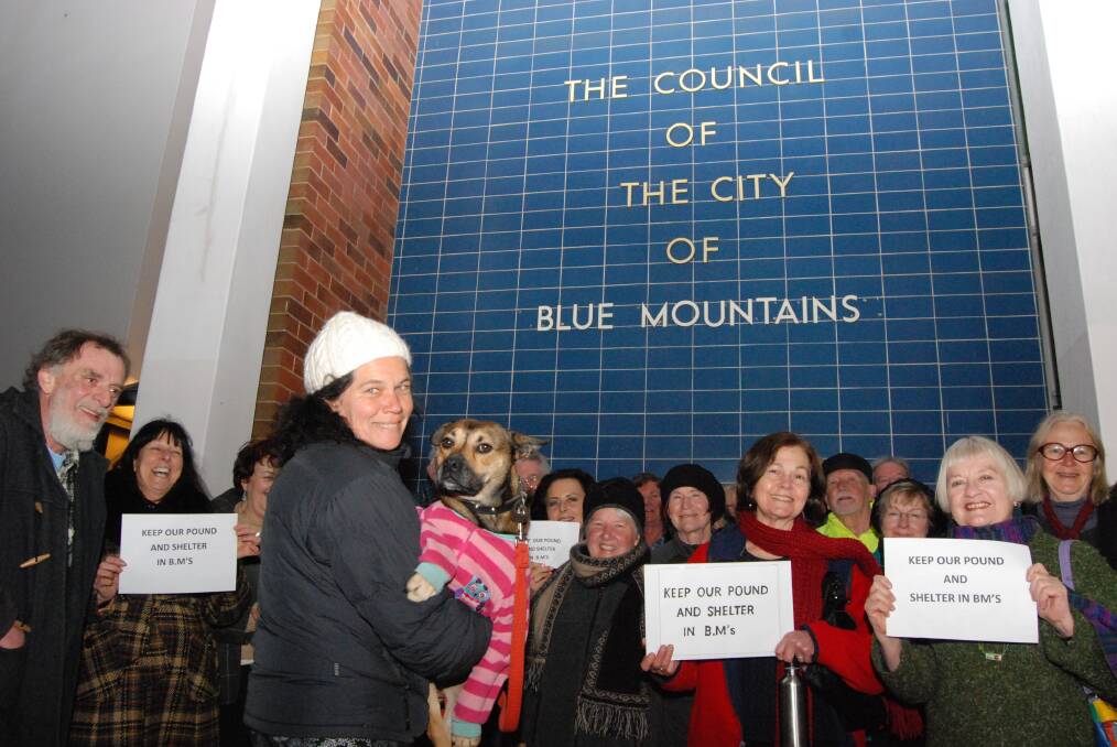 Supporters of the Keep Our Pound Local campaign, including Alandra Tasare and her dog Jessi, in a display of solidarity before the council meeting on September 16.