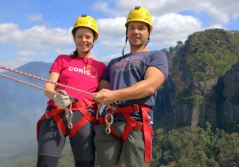 Slovenian couple and travel bloggers Nina and Simon Kogej prepare to abseil in Katoomba with High 'n' Wild as part of the YHA and Hostels International s Big Blog Exchange.