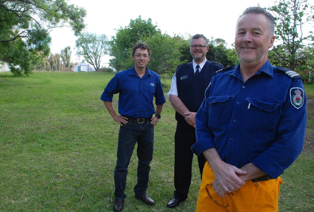 The site of the new station on Singles Ridge Road, part of Oasis Horticulture's land. Oasis has entered into a peppercorn lease with council to provide the Winmalee RFS brigade's Yellow Rock station. Pictured are Winmalee RFS brigade captain Anthony Black (front) with Oasis Nursery manager Brett Sidebottom and RFS chief David Jones (centre).