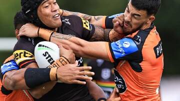 Brian To'o of the Panthers is tackled during his side's 22-6 victory over Wests Tigers in Bathurst. (Mark Evans/AAP PHOTOS)