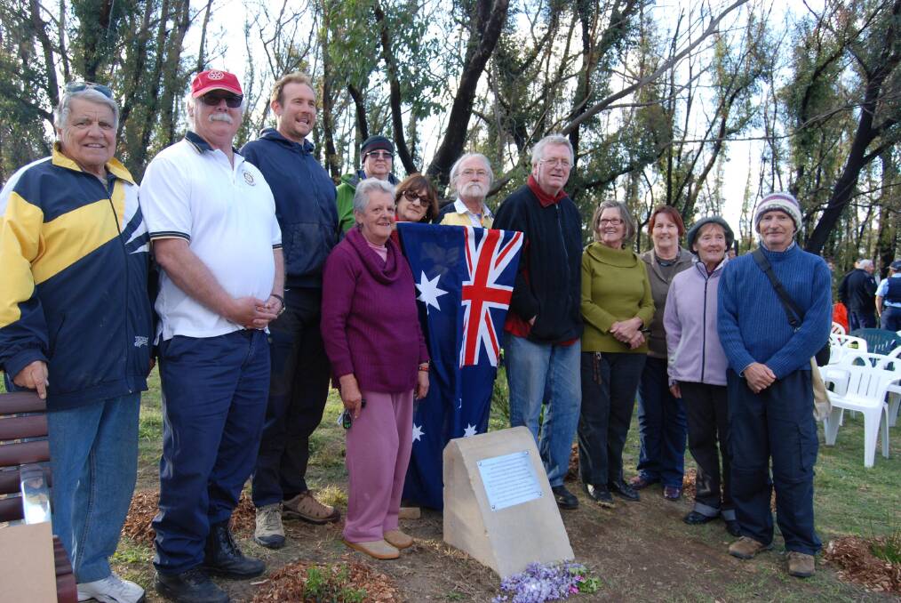 Residents of St Georges Parade and nearby Closeburn Drive at the unveiling of the memorial plaque and bench on Friday.