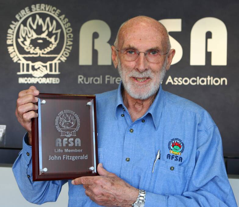 John Fitzgerald with his coveted life membership award from the Rural Fire Service Association. Picture: Gary Warrick