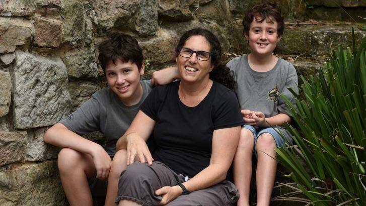 Robyn Bernstein, with her sons Ed and Kai Hall, questions why Special Religious Education should be held in class time. Photo: Steven Siewert