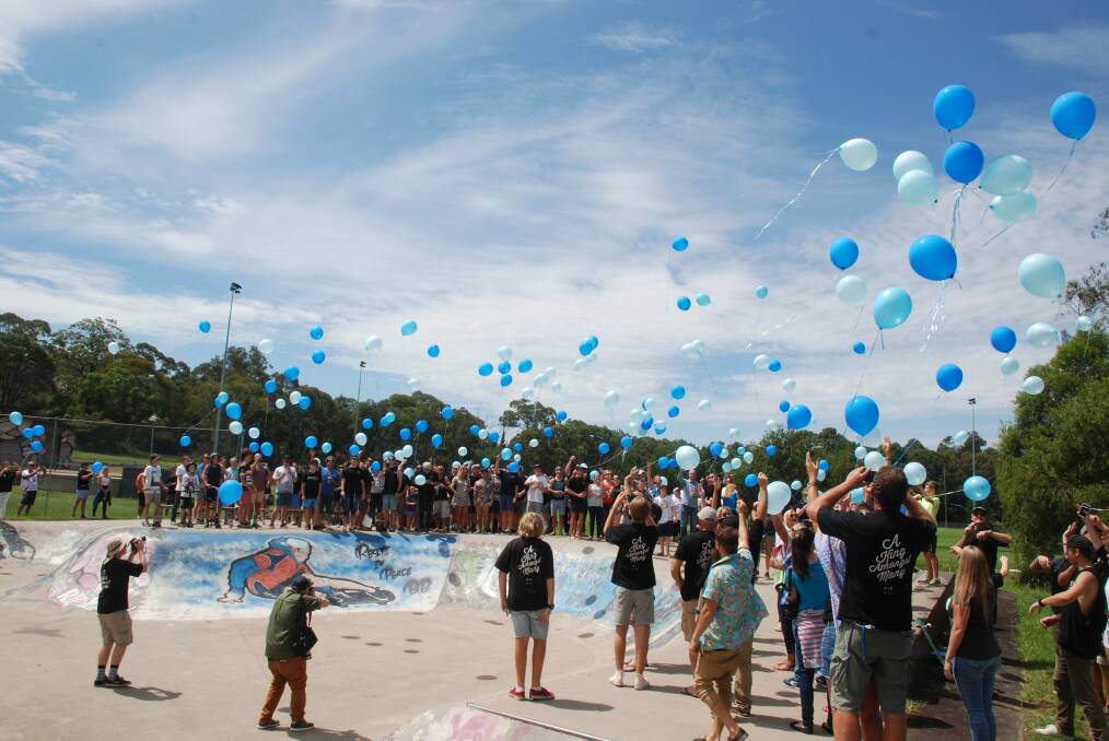 Family and friends of Jarrod Samson-Hills release balloons in his memory at Glenbrook skate park on Saturday. Pictures: Damien Madigan