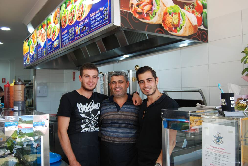 Mo and Sezer Tasuzas with dad Ibrahim in their new Lawson pizza and kebab shop.