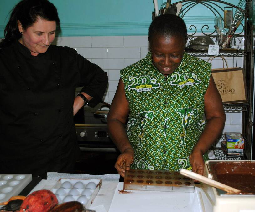 Cocoa farmer Mary Appiah from Ghana enjoys a chocolate-making workshop with Leura chocolatier Jodie Van Der Velden at Josophan's Fine Chocolates earlier this month.
