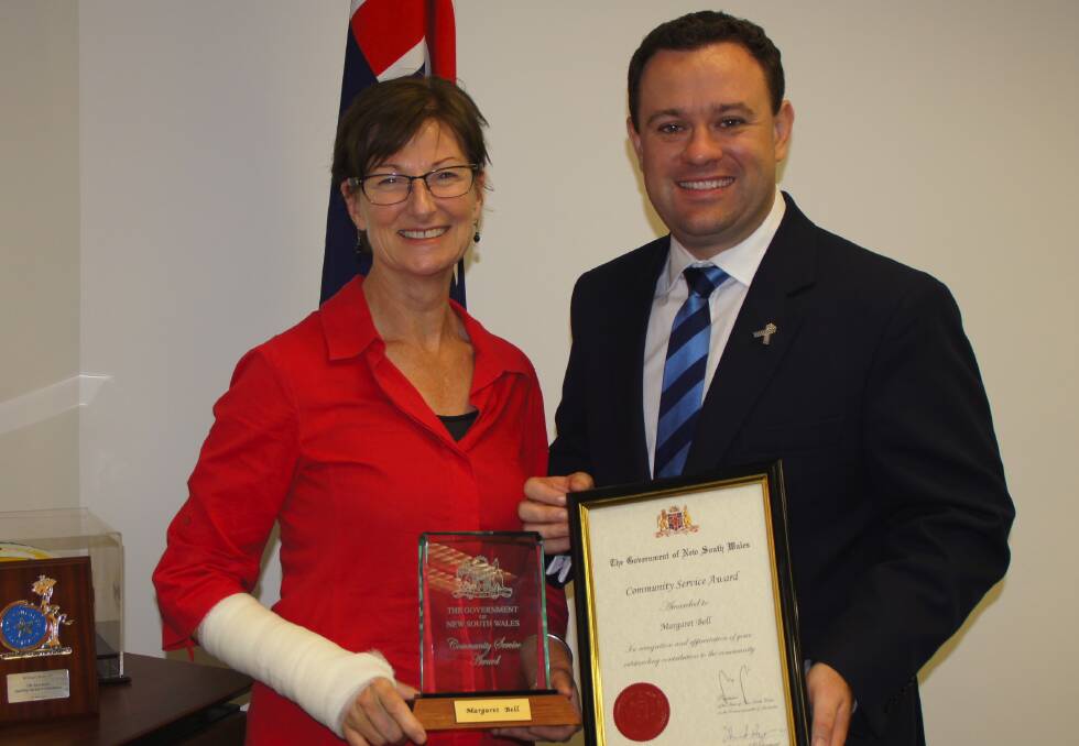  Glenbrook midwife Margaret Bell from Medecins Sans Frontieres Australia (Doctors Without Borders) accepts a community service award from Member for Penrith Stuart Ayres.
