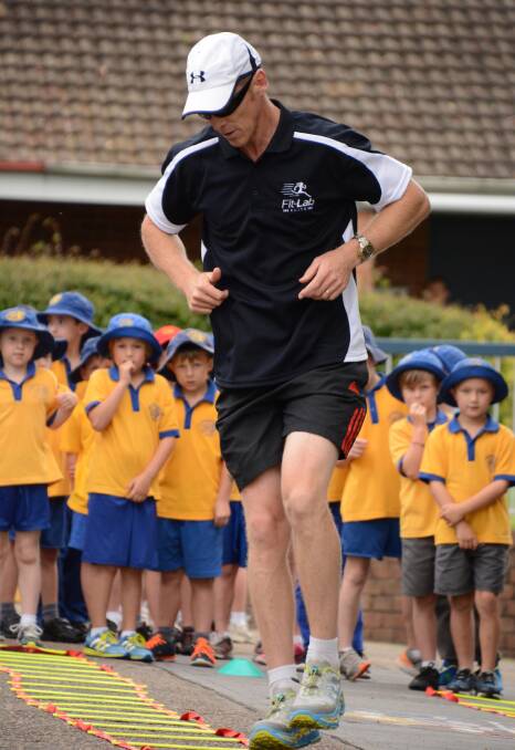 FitLab instructor Brendan Luchetti demonstrates a stepping drill, closely observed by Faulconbridge Public School students.