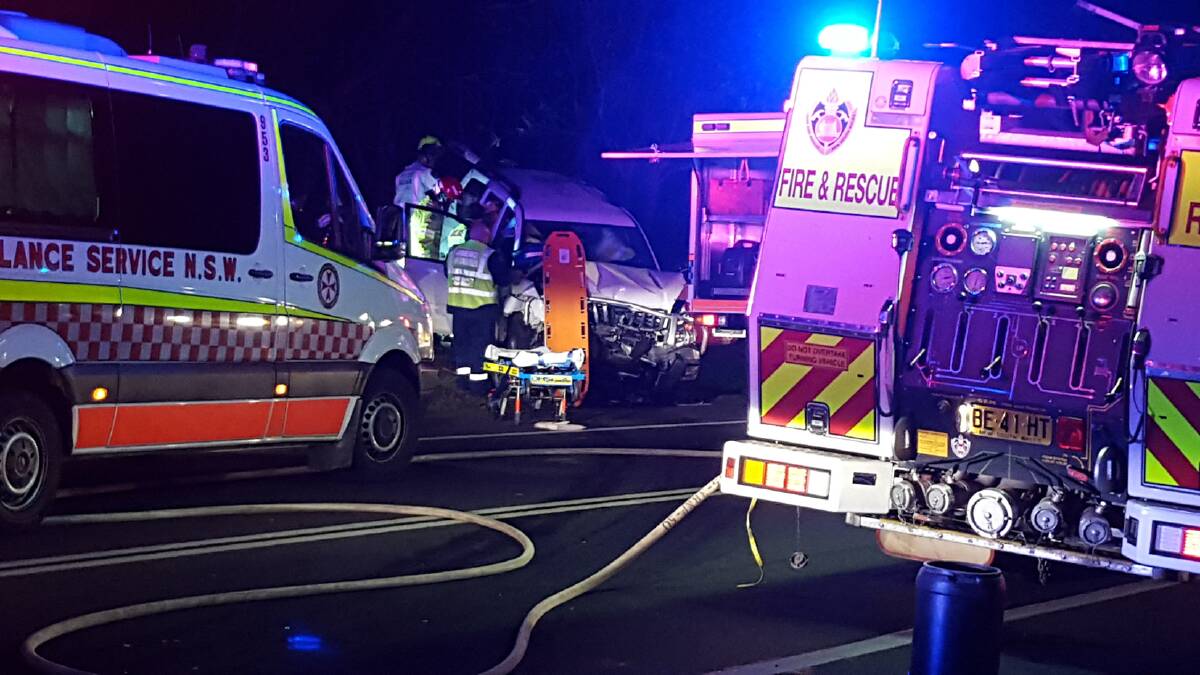 Fire and Rescue NSW and Ambulance personnel work at the scene of a serious two-car crash on Hawkesbury Road, Springwood early on Saturday morning. Photo: Top Notch.