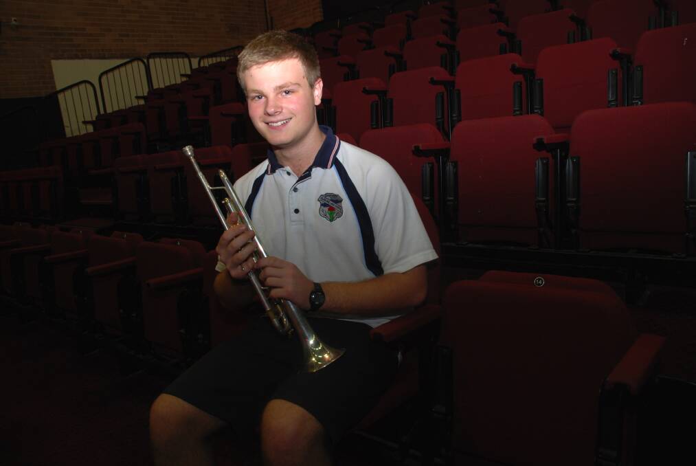 Mixing it up: Matthew Carter, 15 has a big future ahead after playing with the London Symphony. He's pictured here in the Blaxland High School auditorium which now has the old civic centre's 200 tiered seats in place where he had a major role in the music of the show Hairspray.